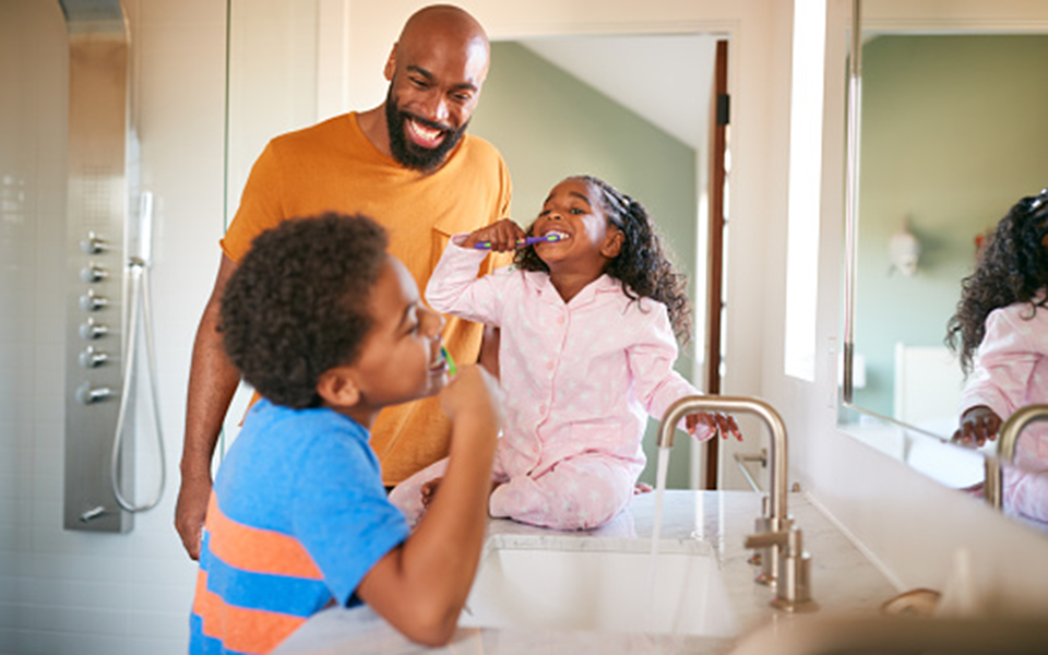 family brushing teeth