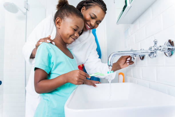 Provider showing a child how to brush their teeth
