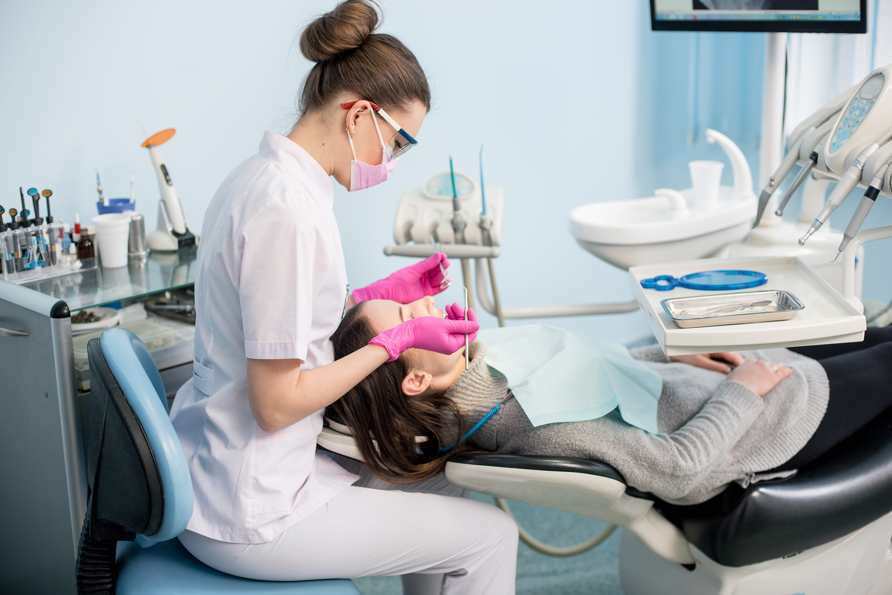 Dental Hygienist cleaning a child's teeth