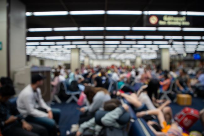 People in waiting room at airport