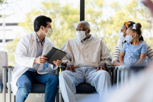 Dentist talking to family