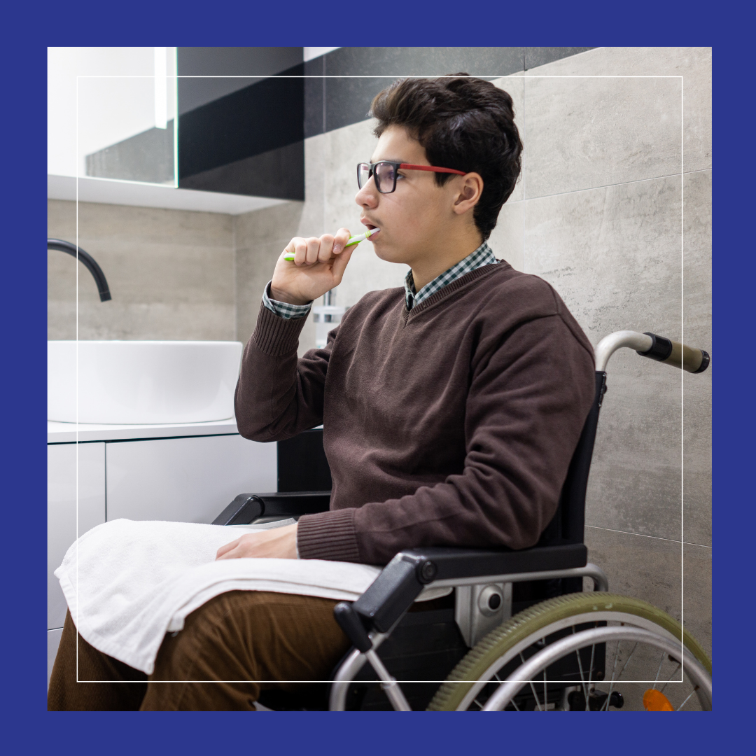 Young person in wheelchair brushing their teeth.