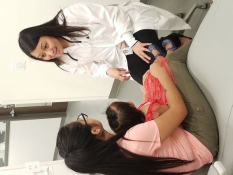 An Nguyen, DDS, talks to patients