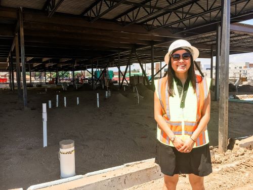 An Nguyen, DDS, MPH, in front of Clinica's latest dental clinic build