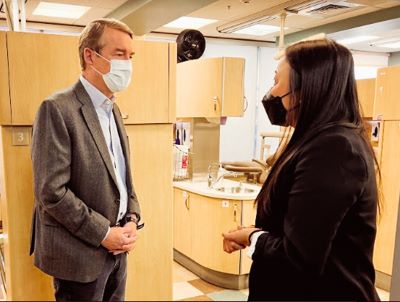 An Nguyen, DDS, MPH, talks to provider