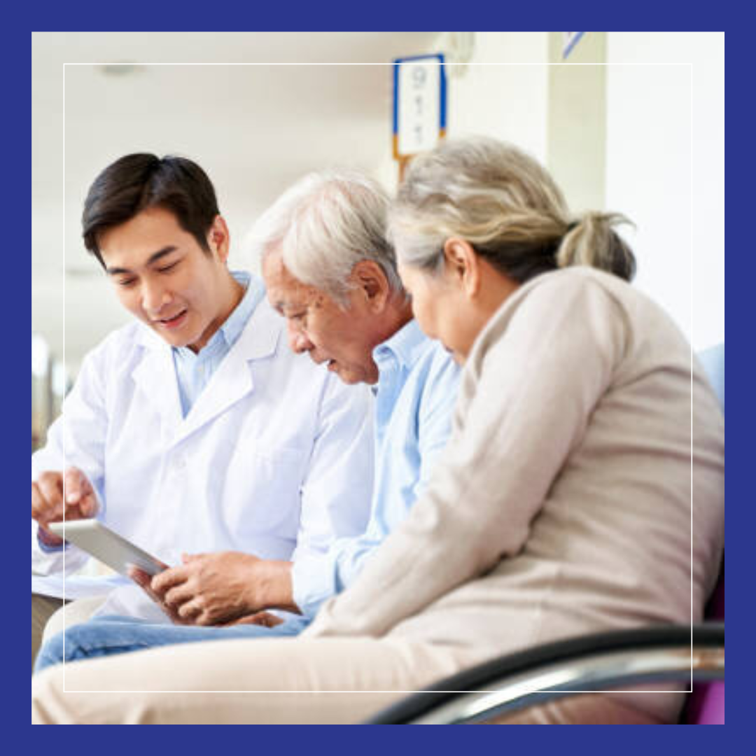 VBC - Doctor talking with elderly couple.  