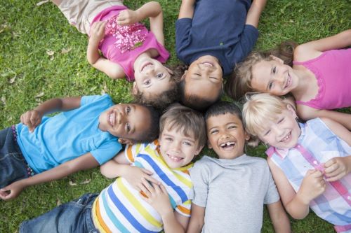 children laying down in a circle