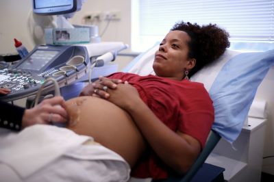Woman receives ultrasound at doctor's office