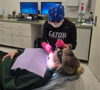 Mary Lynne Davis looking into patient's mouth