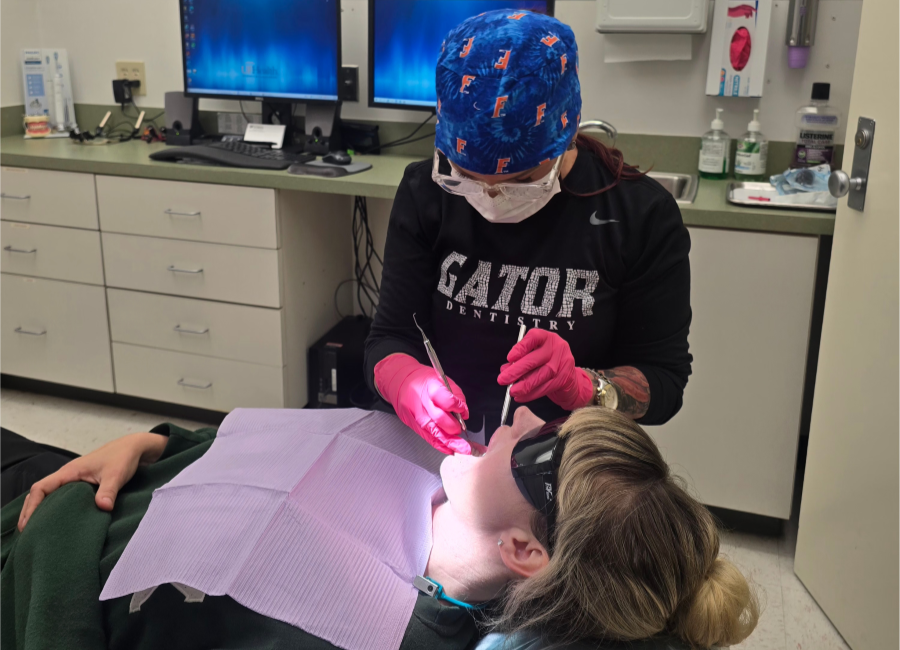 Mary Lynne Davis looking into patient's mouth 900X650