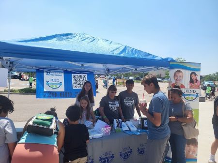 KIND junior promotoras talk to other kids in their community