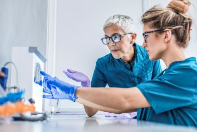 Medical and dental professional examining x-ray
