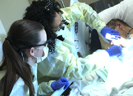 Sheba Jones, RDH, and dental hygiene student providing oral care