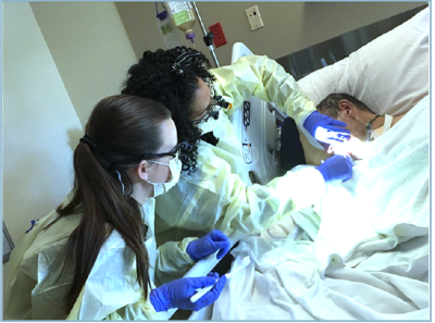 Sheba Jones, RDH, and dental hygiene student providing oral care