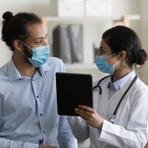 Female provider with patient looking at tablet