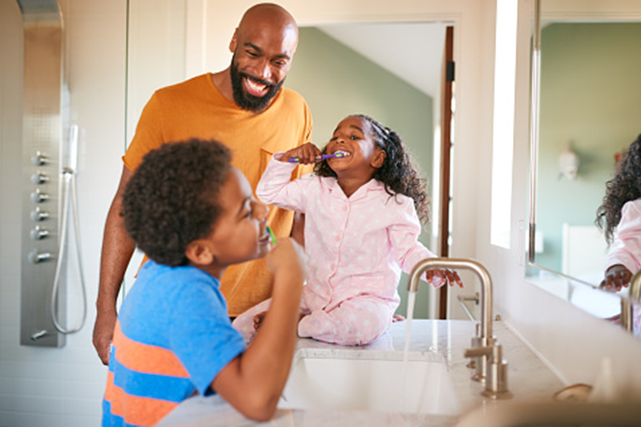 family brushing teeth