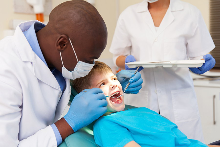provider and child teeth cleaning