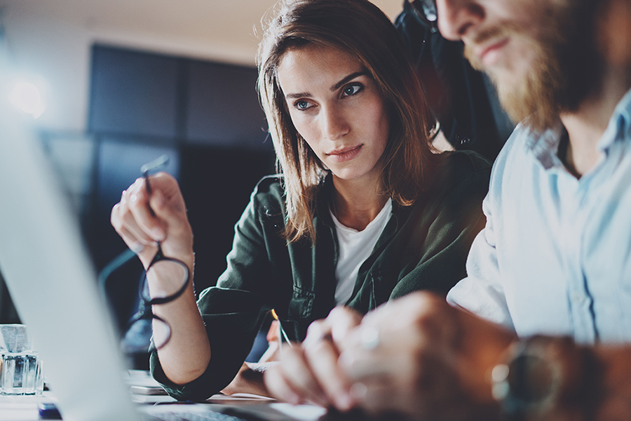 Image of woman and man looking at computer screen